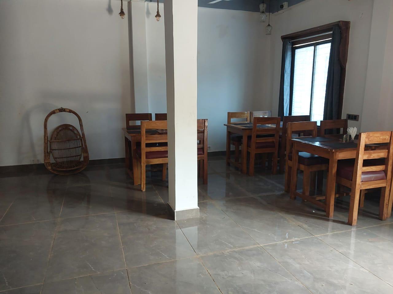 Luxury resort pool with palm trees at sunset